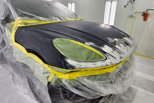 Porsche Macan paint repairs at 9 Auto Motion Palm Beach County FL