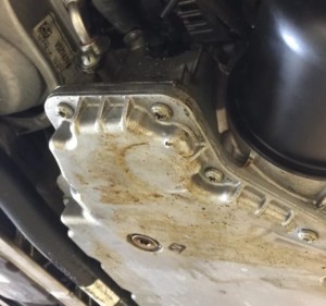 timing cover leak on macan causes oil on the oil pan