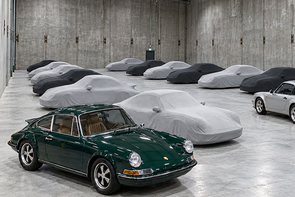 Covered classic Porsches in the dedicated storage area at Blair Talbot Motors.