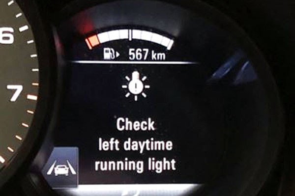 Porsche Check Left/Right Daytime Running Light message