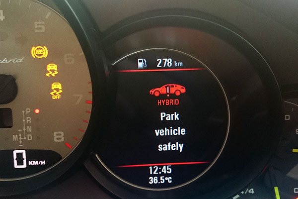 Porsche hybrid park vehicle safely message